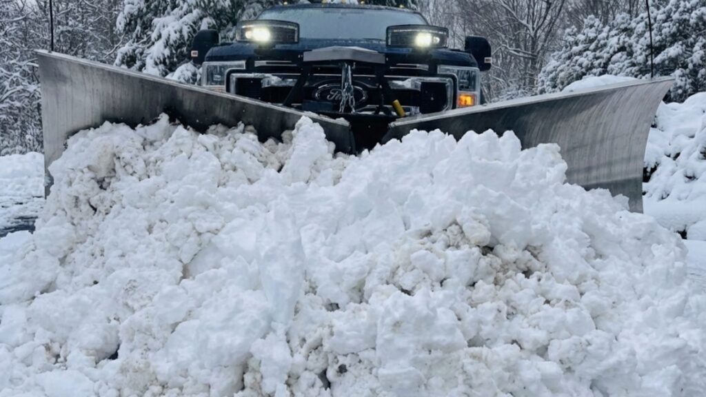 Front View Snow Plow Clearing Deep CT Road Snow