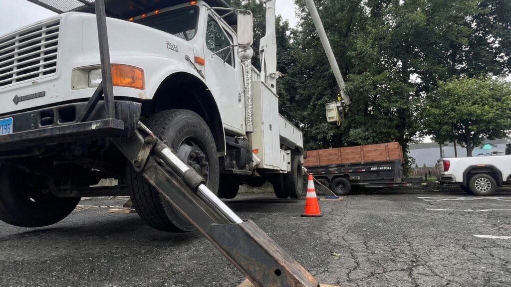 Bucket Truck Stabilizers and Lift in Use for Connecticut Tree Removal