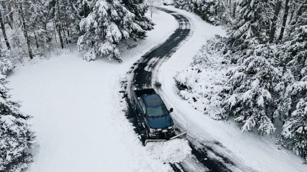 Snow Removal Truck Clearing Curved CT Driveway