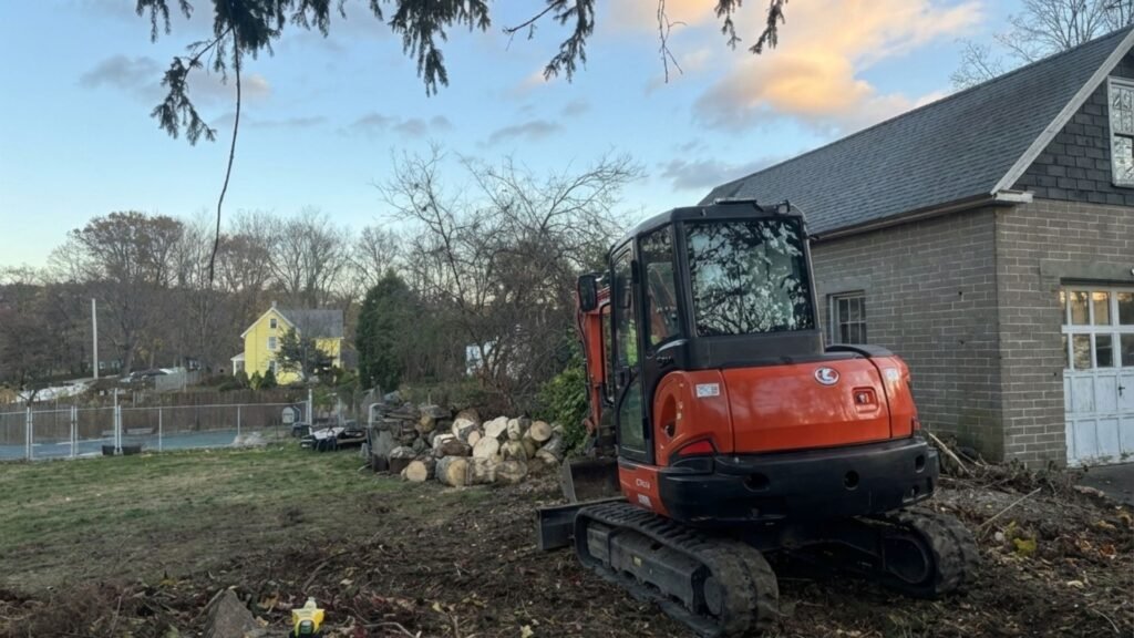 Excavator positioned during residential tree removal work in Seymour Connecticut